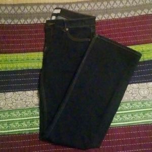 Never worn Dark wash mid rise boot cut denim with back button pockets
